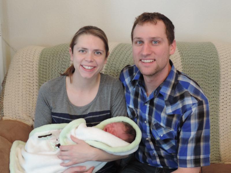 Steva and Brian with newborn Ivan