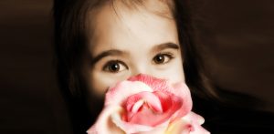 Elisha Lancaster holding a rose