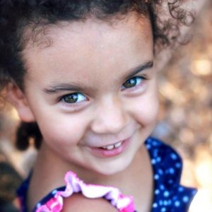A smiling toddler born through embryo adoption