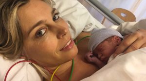 A mother holding her newborn
